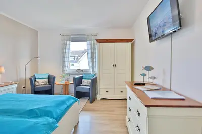 Ein Bett oder Betten in einem Zimmer der Unterkunft Ferienhaus Brandt Ferienhaus Brandt Appartement 2 Plattschnacker