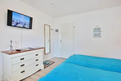 Ein Bett oder Betten in einem Zimmer der Unterkunft Ferienhaus Brandt Ferienhaus Brandt Appartement 2 Plattschnacker