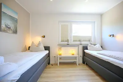 Ein Bett oder Betten in einem Zimmer der Unterkunft Ferienhaus Brandt Ferienhaus Brandt Appartement 3 Möwenkieker