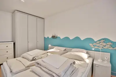 Ein Bett oder Betten in einem Zimmer der Unterkunft Seebrücke Seebrücke Appartement 3