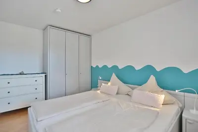 Ein Bett oder Betten in einem Zimmer der Unterkunft Seebrücke Seebrücke Appartement 3