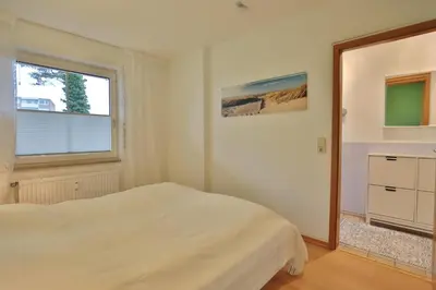 Ein Bett oder Betten in einem Zimmer der Unterkunft Haus Windrose Windrose Appartement 3