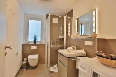 Ein Badezimmer in der Unterkunft Dünenhaus Dünenhaus 3 Appartement 9