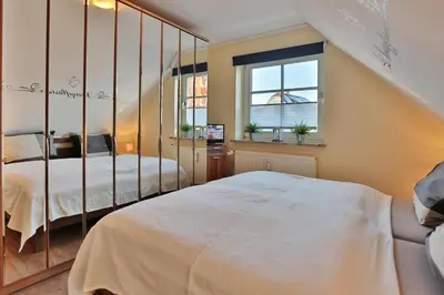 Ein Bett oder Betten in einem Zimmer der Unterkunft Parkresidenz Parkresidenz Appartement 13