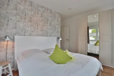 Ein Bett oder Betten in einem Zimmer der Unterkunft Haus Meeresbrise Haus Meeresbrise Appartement 18