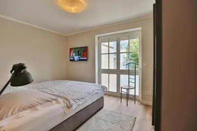 Ein Bett oder Betten in einem Zimmer der Unterkunft Hanseaten Residenz Hanseaten-Residenz Appartement 14