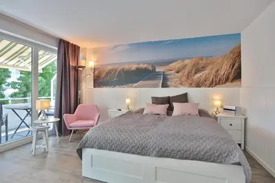 Ein Bett oder Betten in einem Zimmer der Unterkunft Strandhotel Scharbeutz Sweet little Beachside
