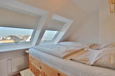 Ein Bett oder Betten in einem Zimmer der Unterkunft Seebrücke Seebrücke Appartement 26