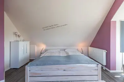 Ein Bett oder Betten in einem Zimmer der Unterkunft Möwenberg-Residenz Möwenberg-Residenz Appartement 12 Romantiknest