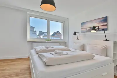 Ein Bett oder Betten in einem Zimmer der Unterkunft Haus Hansastrasse 1 Haus Hansastrasse 1 Appartement 4
