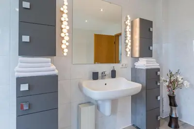 Ein Badezimmer in der Unterkunft Ferienhaus Glockenstraße Ferienwohnung Ostseehöhe Appartement 2