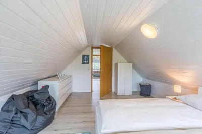 Ein Bett oder Betten in einem Zimmer der Unterkunft Ferienhaus Glockenstraße Ferienwohnung Ostseehöhe Appartement 2