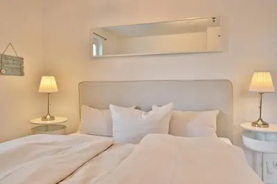 Ein Bett oder Betten in einem Zimmer der Unterkunft Ostseeperle Ostseeperle Appartement 2