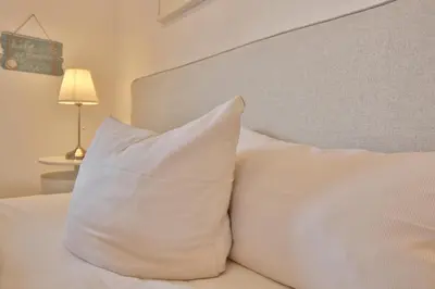 Ein Bett oder Betten in einem Zimmer der Unterkunft Ostseeperle Ostseeperle Appartement 2