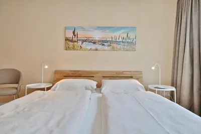Ein Bett oder Betten in einem Zimmer der Unterkunft Haus Seerose Seerose II Appartement 14