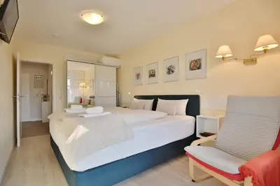 Ein Bett oder Betten in einem Zimmer der Unterkunft Strandperle Strandperle Appartement 203