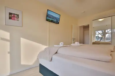 Ein Bett oder Betten in einem Zimmer der Unterkunft Strandperle Strandperle Appartement 203