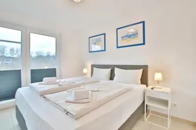 Ein Bett oder Betten in einem Zimmer der Unterkunft Strandglück Haus C Strandglück Appartement 14C