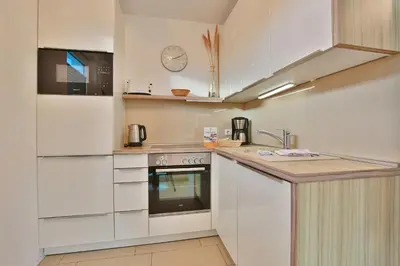 Küche/Küchenzeile in der Unterkunft Strandglück Haus C Strandglück Appartement 14C