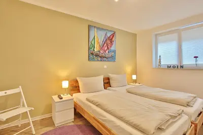 Ein Bett oder Betten in einem Zimmer der Unterkunft Bude 30 Bude 30 Tilly Appartement 2