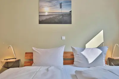 Ein Bett oder Betten in einem Zimmer der Unterkunft Bude 30 Bude 30 Tilly Appartement 2