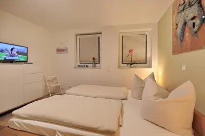 Ein Bett oder Betten in einem Zimmer der Unterkunft Bude 30 Bude 30 Tilly Appartement 2