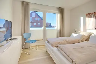Ein Bett oder Betten in einem Zimmer der Unterkunft Villa Seeperle II Herzmuschel Appartement 18