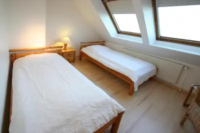 Ein Bett oder Betten in einem Zimmer der Unterkunft Seebrücke Seebrücke Appartement 22