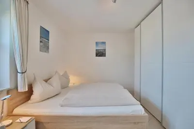 Ein Bett oder Betten in einem Zimmer der Unterkunft Haus Seerose Seerose II Appartement 13