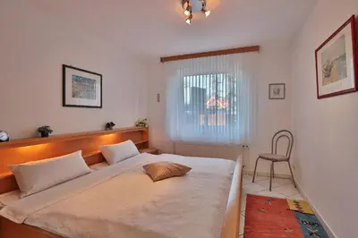 Ein Bett oder Betten in einem Zimmer der Unterkunft Strandschlößchen Strandschlösschen Appartement 3