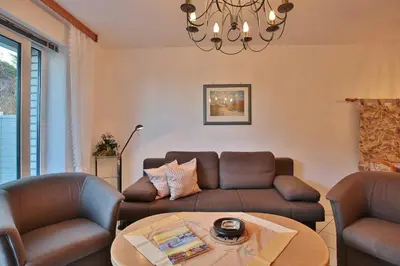 Ein Sitzbereich in der Unterkunft Strandschlößchen Strandschlösschen Appartement 3