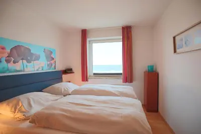 Ein Bett oder Betten in einem Zimmer der Unterkunft Strandschlößchen Strandschlösschen Appartement 9