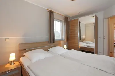 Ein Bett oder Betten in einem Zimmer der Unterkunft Residenz Alte Bergstraße Residenz Alte Bergstrasse Appartement 7
