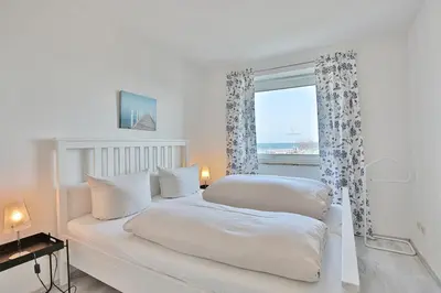 Ein Bett oder Betten in einem Zimmer der Unterkunft Strandschlößchen Strandschlösschen Appartement 5
