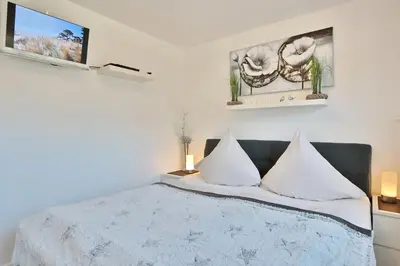 Ein Bett oder Betten in einem Zimmer der Unterkunft Residenz am Fischerstieg Residenz am Fischerstieg Appartement 16