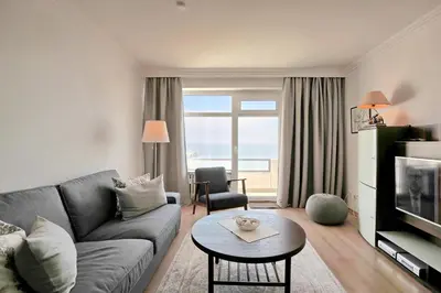 Ein Sitzbereich in der Unterkunft Strandperle Strandperle Appartement 306