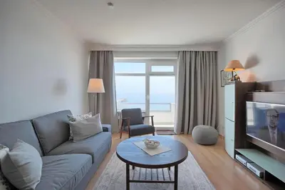 Ein Sitzbereich in der Unterkunft Strandperle Strandperle Appartement 306
