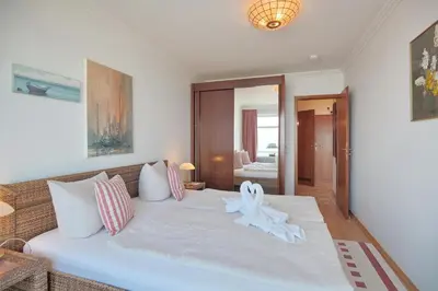 Ein Bett oder Betten in einem Zimmer der Unterkunft Strandperle Strandperle Appartement 306