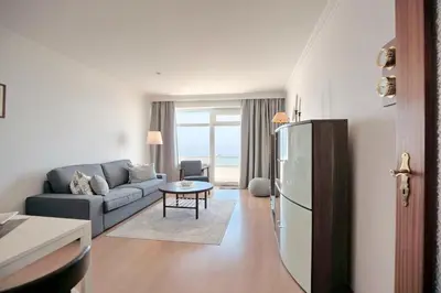 Ein Sitzbereich in der Unterkunft Strandperle Strandperle Appartement 306