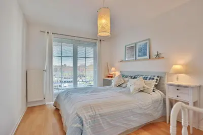Ein Bett oder Betten in einem Zimmer der Unterkunft Stranddomizil Stranddomizil Appartement 13