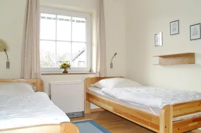 Ein Bett oder Betten in einem Zimmer der Unterkunft Parkdomizil Parkdomizil Appartement 6