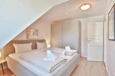 Ein Bett oder Betten in einem Zimmer der Unterkunft Hansa Residenz II Hansa-Residenz II Appartement 28
