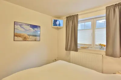 Ein Bett oder Betten in einem Zimmer der Unterkunft Strandvilla Strandvilla Appartement 18