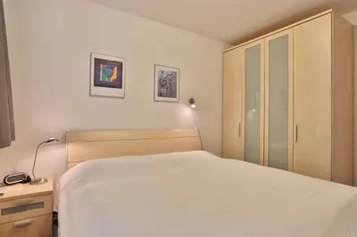 Ein Bett oder Betten in einem Zimmer der Unterkunft Strandvilla Strandvilla Appartement 18
