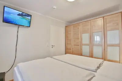 Ein Bett oder Betten in einem Zimmer der Unterkunft Strandvilla Strandvilla Appartement 3