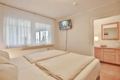 Ein Bett oder Betten in einem Zimmer der Unterkunft Strandvilla Strandvilla Appartement 3