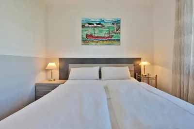 Ein Bett oder Betten in einem Zimmer der Unterkunft Residenz am Fischerstieg Residenz am Fischerstieg Appartement 20