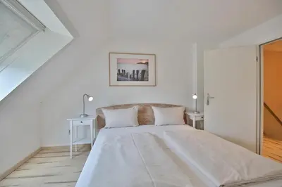 Ein Bett oder Betten in einem Zimmer der Unterkunft Haus am Ahornweg 2 Haus am Ahornweg 2C Appartement 7