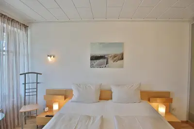 Ein Bett oder Betten in einem Zimmer der Unterkunft Strandperle Strandperle Appartement 101