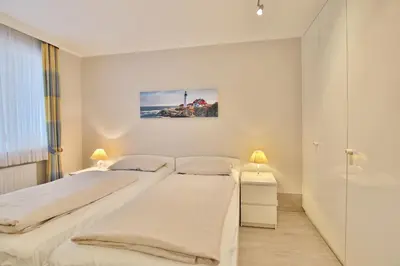 Ein Bett oder Betten in einem Zimmer der Unterkunft Seebrücke Seebrücke Appartement 13
